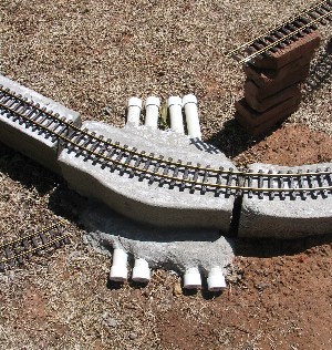 Pipes placed under the track base for utilities